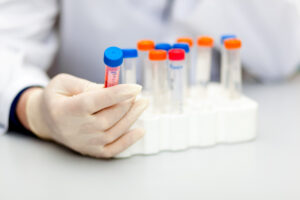Scientist looking at a test tube