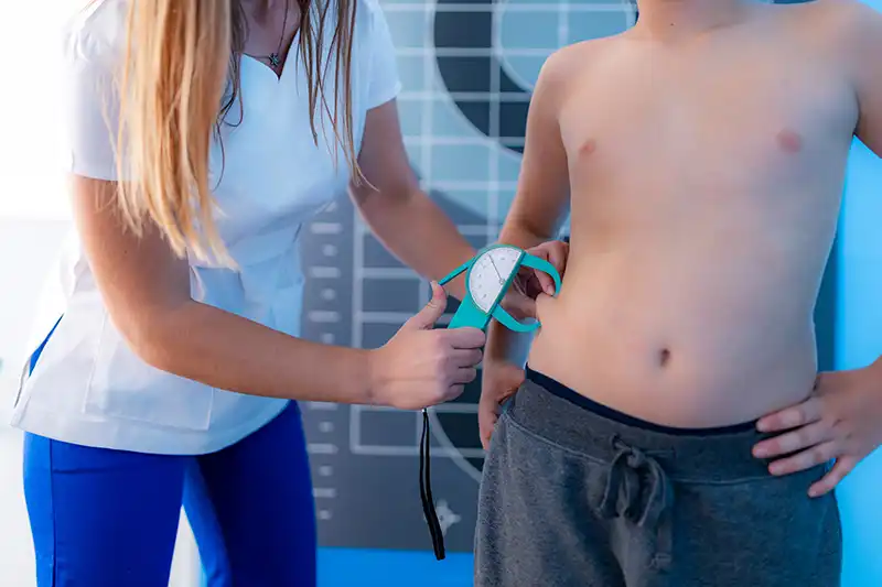 doctor using calipers on patient at urgent care