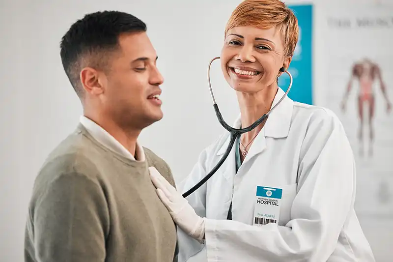smiling doctor and patient during urgent care visit