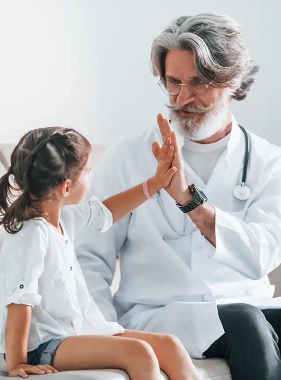 senior male doctor with grey hair and beard